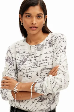 Blouse with adjustable sleeves and text prints.