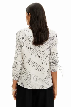 Blouse with adjustable sleeves and text prints.