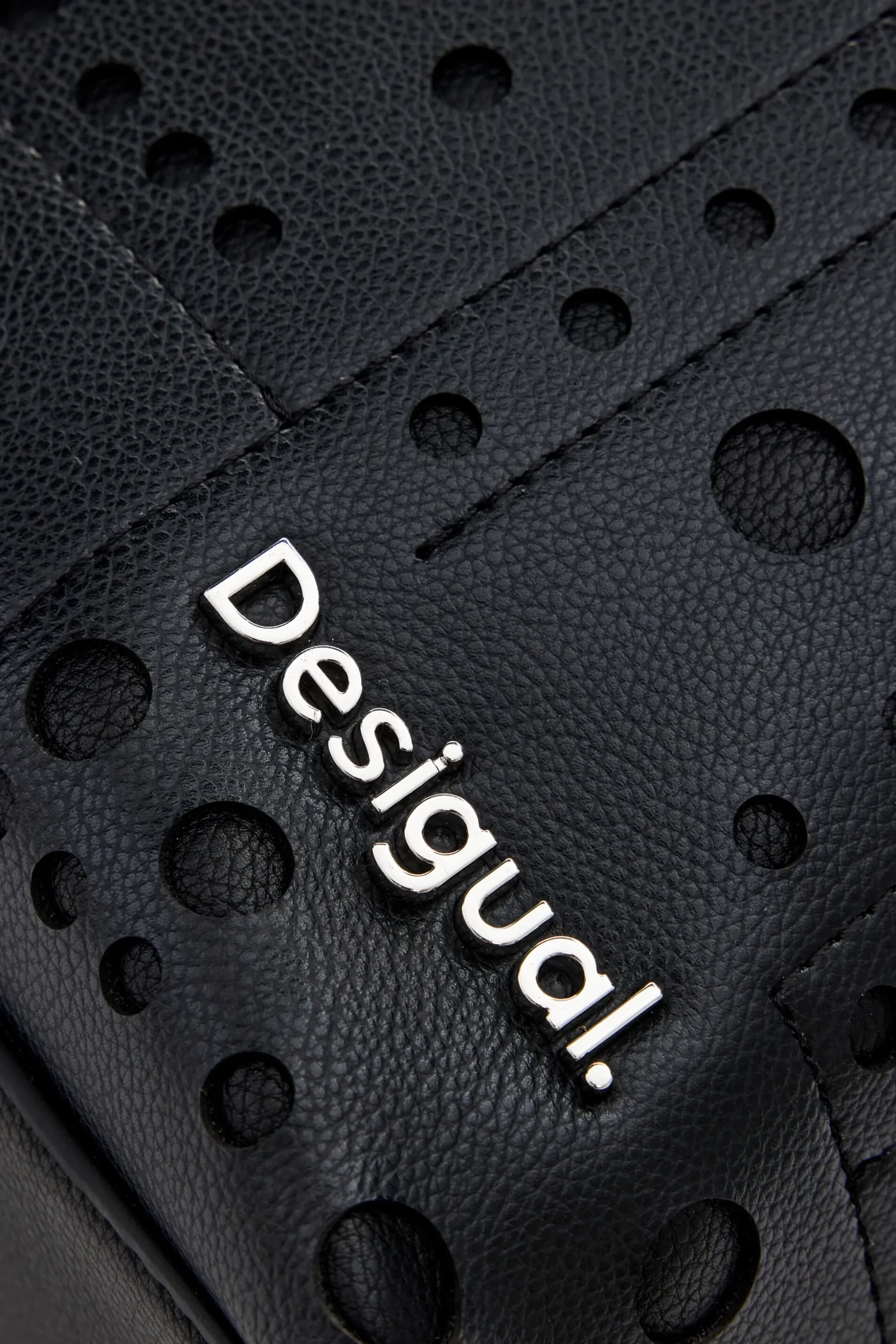 Circle pattern faux leather backpack