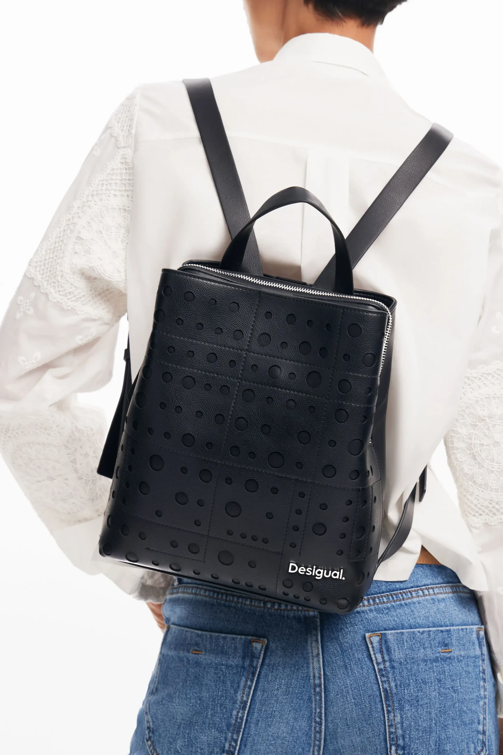 Circle pattern faux leather backpack