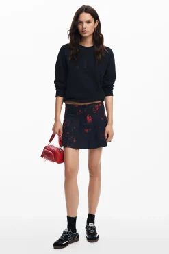 Pleated miniskirt by M. Christian Lacroi