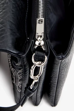 S bag with butterfly engraving
