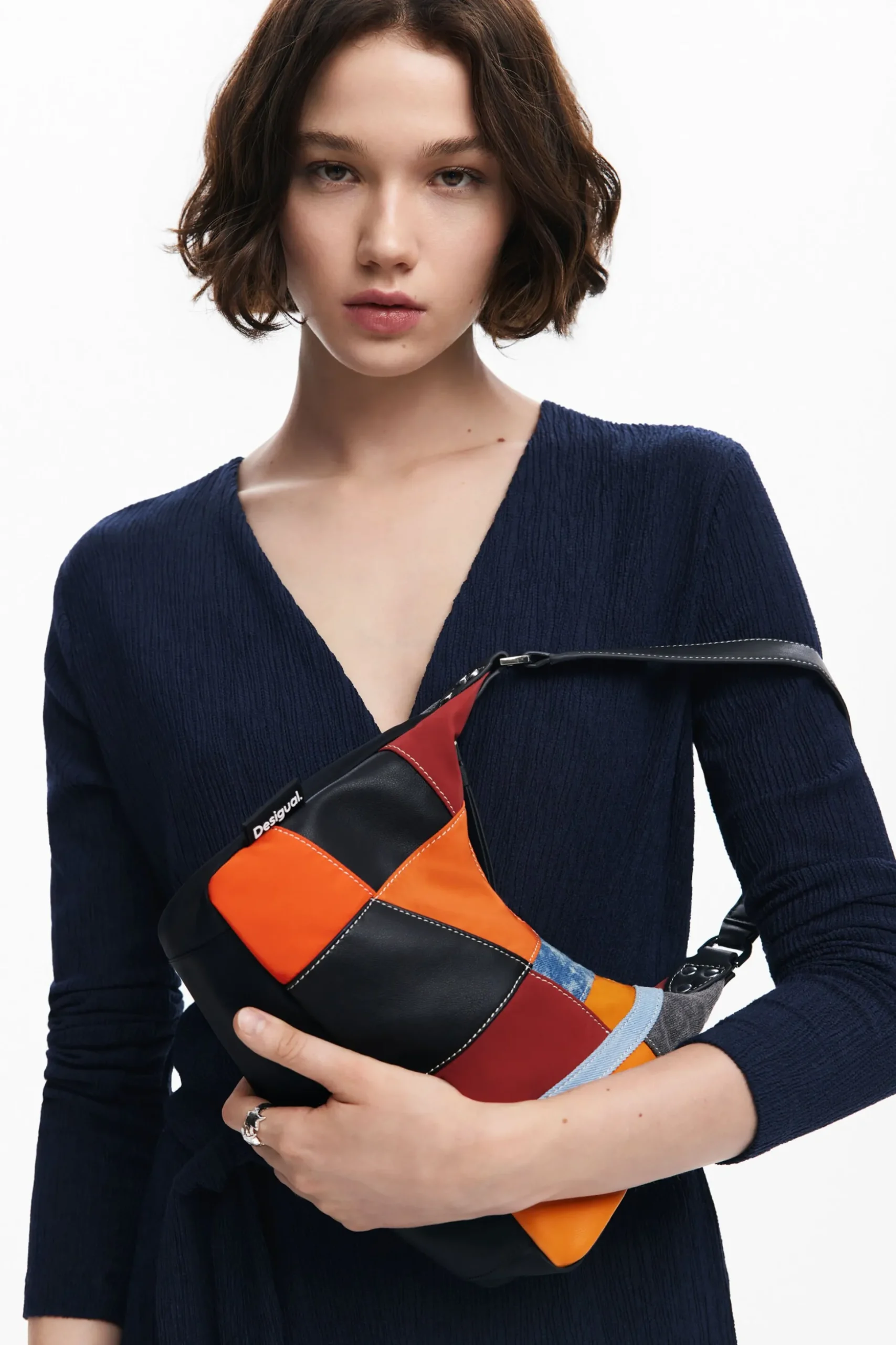 Textured patch shoulder bag